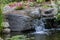 Landscape architecture featuring waterfalls and perennials for backyard oasis