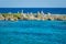 Landscape with balanced rocks, stones on a rocky coral pier. Turquiose blue Caribbean sea water. Riviera Maya, Cancun, Mexico.