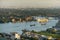 Landscape of Bangkok from above, warehouses and factories on the riverside. Large cargo ship parked And there are many boats in th