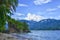 Landscape of Beach with Hill, Rock, Trees, Blue Sky and White Cloud