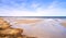 Landscape of beach sand with ocean and blue cloudy sky background on the Eastcoast shoreline line Kattegat, Jutland
