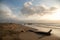 Landscape of a beach at sunset in Barranquilla with fishermen working in the background. Colombia.