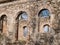 Landscape with beautiful abandoned church ruins, arched windows, stone walls, building without a roof