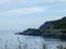 Landscape with beautiful green overgrown rocks at the fjord, beautiful sea water