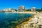 Landscape of the beautiful pebble beach of the Cote d`Azur at sunny morning. Beach holidays by the calm Mediterranean Sea. France.