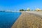 Landscape of the beautiful pebble beach of the Cote d`Azur at sunny morning. Beach holidays by the calm Mediterranean Sea. France