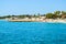 Landscape of the beautiful pebble beach of the Cote d`Azur at sunny morning. Beach holidays by the calm Mediterranean Sea. France