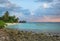 Landscape of a beautiful tropical rocky and sandy beach in Maldives island.