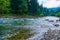 Landscape, beautiful view of mountain river in summer day, fast flowing water and rocks, wild nature