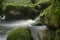 Landscape of Becky Falls waterfall in Dartmoor National Park Eng