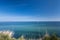 Landscape of blue Baltic sea with white sand and sky in north Germany