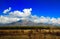 Landscape with blue sky and clouds.