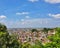 Landscape, blue sky over crowded city