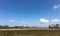 Landscape blue sky view and a desolate meadow field