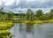 Landscape from the bog, bog after rain, bog lake, dark storm clouds, traditional bog vegetation, heather, grass, bog pines,