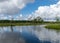 Landscape from the bog, bog after rain, bog lake, dark storm clouds, traditional bog vegetation, heather, grass, bog pines,