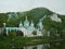 Landscape with the buildings of the Holy Dormition Lavra and caves on the river bank.