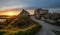 A landscape with the Chateau Gaillard (Saucy Castle) at sunset with the sun in back-light