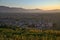 Landscape of Chinese countryside at sunset; silhouette of village and hills