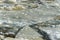 Landscape closeup ice drift on the river at the end of winter on a sunny day.