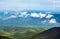 Landscape with clouds, mountains, blue sky and village