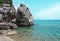 Landscape with coastal cliffs and calm sea on a sunny day