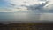 Landscape of coastline with sea at a summer day and flying drone over it