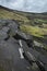 Landscape of collapsed A625 road in Peak District UK