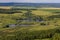 Landscape with cows, lake, forest. View from the mountain Toratau