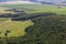 Landscape with cows, lake, forest. View from the mountain Toratau