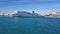 A landscape with a cruise ship, on a sunny day in harbor.