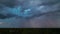 Landscape of dark ominous clouds forming on stormy sky before heavy thunderstorm over rural town area