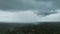 Landscape of dark ominous clouds forming on stormy sky during heavy thunderstorm over rural town area