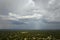 Landscape of dark ominous clouds forming on stormy sky during heavy thunderstorm over rural town area