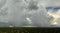 Landscape of dark ominous clouds forming on stormy sky during heavy thunderstorm over rural town area