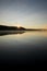 Landscape at Dawn with Still Water, Sunrise, Flying Bird and Reflection of Bird