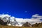 Landscape of deep blue sky and ice capped peaks of himalayan mountains with white clouds during day time