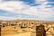 Landscape of Delos Island in Greece - view from the hill on the island with blue cloudy sky and big area of ancient ruins