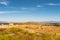 Landscape of Delos Island in Greece - view from the hill on the island with crystal blue sky and big area of ancient ruins