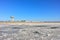 Landscape of a deserted salt lake. The texture of salt formations in the foreground. salt lake surface, dry salt lake, white salt