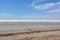 Landscape of a deserted salt lake. The texture of salt formations in the foreground. salt lake surface, dry salt lake, white salt