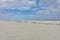 Landscape of a deserted salt lake. The texture of salt formations in the foreground. salt lake surface, dry salt lake, white salt