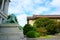 Landscape design. two lions, flowers, trees and a white brick building