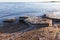 Landscape with dirty melting ice floes on the coast of Baltic Sea