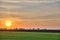 Landscape with distant road at sunrise