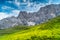 Landscape of Dolomites with green meadows, blue sky, white clouds and rocky mountains. Italian Dolomites landscape. Beauty of natu