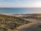 Landscape of the Dunes of Bani surrounded by the sea under the sunlight in the Dominican Republic