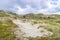 Landscape with dunes under a clouded sky, national park Meijendel