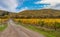 Landscape with earth road leading to remote settlement near Alushta city at fall season, Crimean peninsula