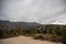 Landscape of Eaton Canyon hiking mountains trails with wild grass under gray sky